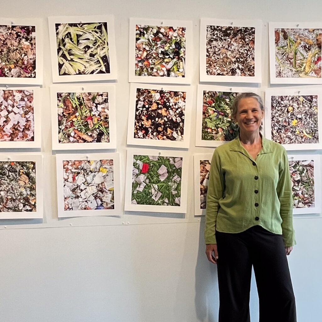 Lyn Swett Miller in front of her photography